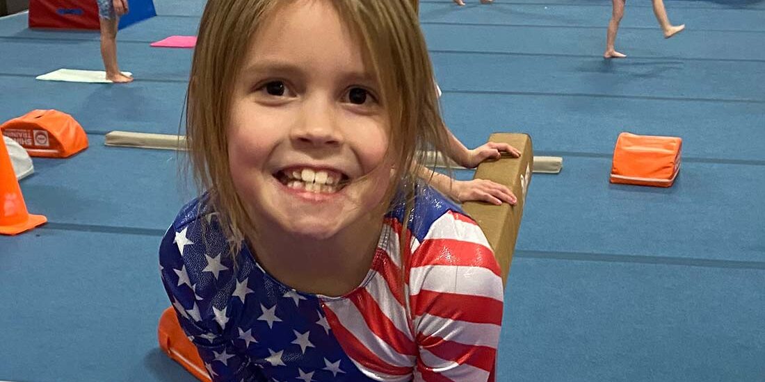 young gymnast in american outfit